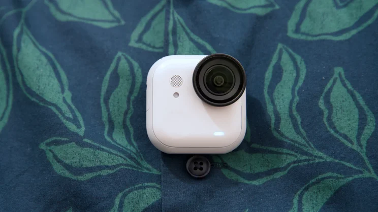 The Insta360 Go Ultra pictured attaced to magnetic pendant through a shirt