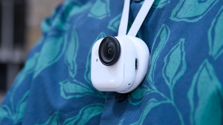 The Insta360 Go Ultra pictured attached to its magnetic pendant
