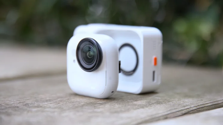 The Insta360 Go Ultra pictured in front of its dock
