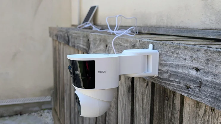 The Aosu Solarcam T2 Pro security camera attached to a wooden surface without its solar panel