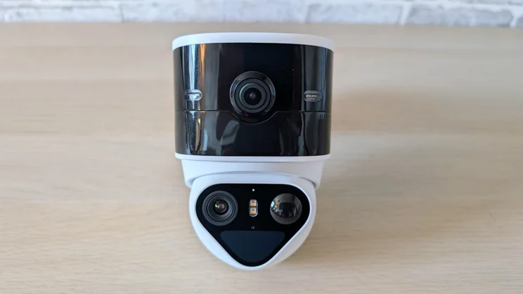 The Aosu Solarcam T2 Pro security camera on a wooden table indoors