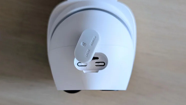 The power and reset buttons on top of the Aosu Solarcam T2 Pro security camera