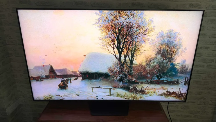 Front view of the Hisense UR9S RGB Mini LED TV displaying a winter scene