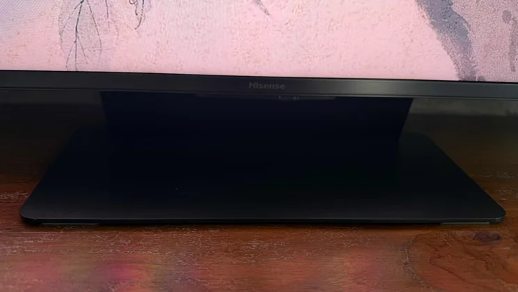 Front view of the stand of the Hisense UR9S RGB Mini LED TV