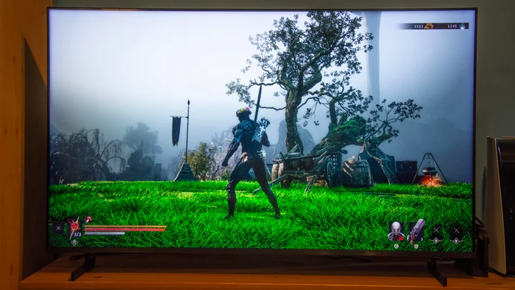 The Samsung QN80H Mini LED TV displaying a screenshot from Mortal Shell II on PS5