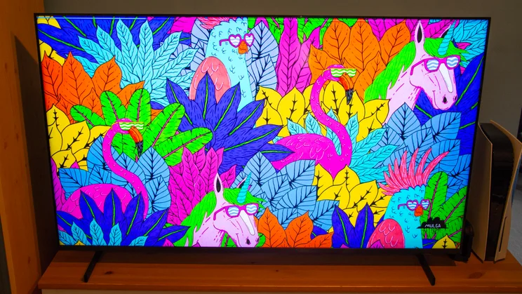 The Samsung QN80H Mini LED TV displaying the vibrant artwork "Mulga X Cotton on Kids"