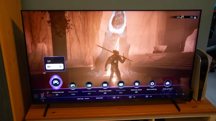 The Samsung QN80H Mini LED TV displaying the Samsung Game Bar during gameplay of Mortal Shell II on PS5