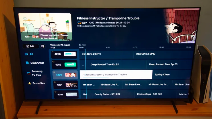 The Samsung QN80H Mini LED TV displaying the Samsung TV Plus EPG