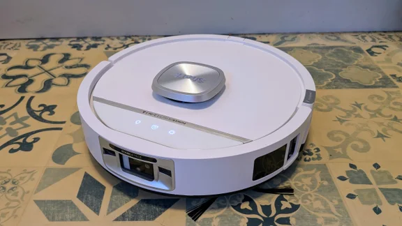 The Shark PowerDetect UV Reveal 2-in-1 robot vacuum on a hard floor with the StainDetect logo visible
