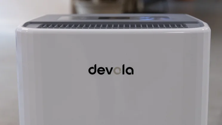 A closeup of the Devola logo on the top of the Devola DVH12L Compressor dehumidifier