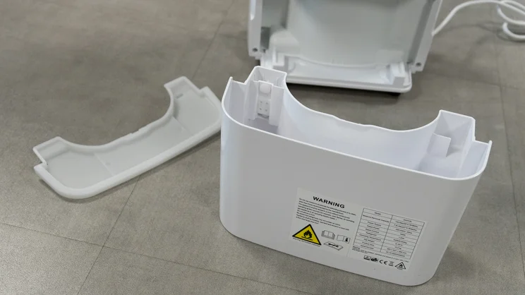 The Devola DVH12L Compressor dehumidifier's water tank, removed