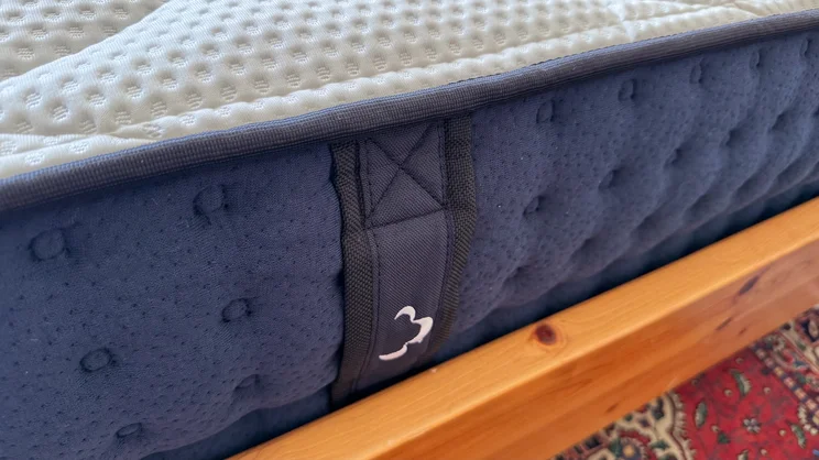A closeup of the side of the DreamCloud Hybrid mattress