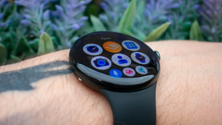 Google Pixel Watch 5 on wrist, angled view, displaying app list