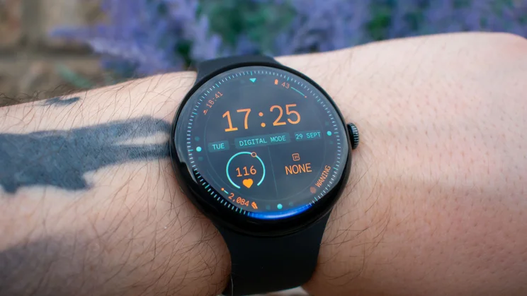 Google Pixel Watch 5 on wrist, displaying home page with Google Gemini light at the bottom