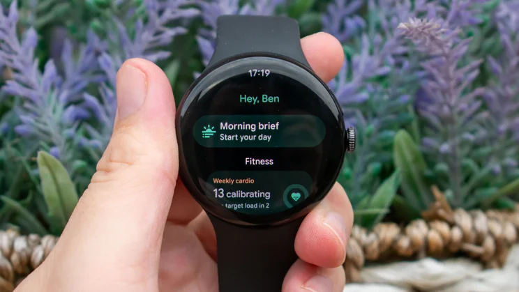 Google Pixel Watch 5 in hand, displaying morning brief