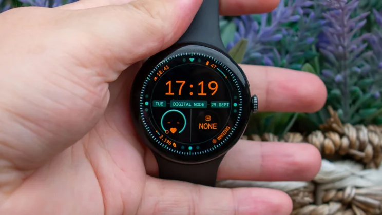Google Pixel Watch 5 in hand, displaying the home page