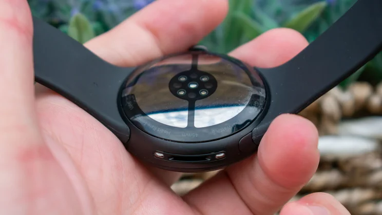 Google Pixel Watch 5 in hand, showing the underside