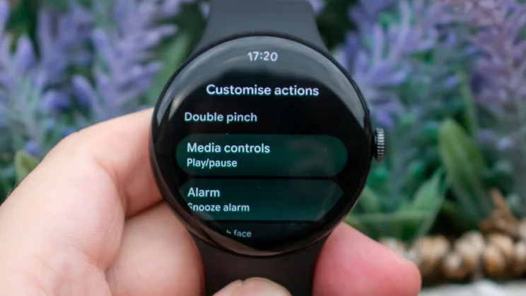 Google Pixel Watch 5 in hand, displaying gesture control options