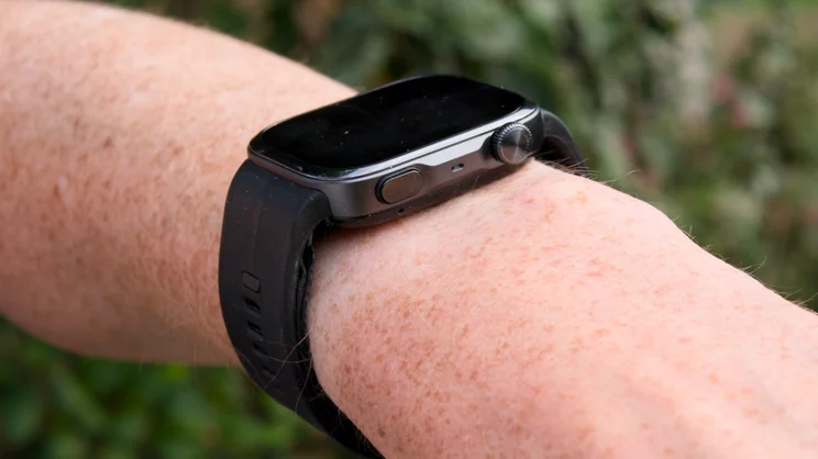 The Huawei Watch D3 on wrist, showing the side button and crown