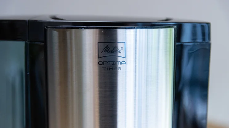 A closeup of the Melitta logo on the Melitta Optima Timer filter coffee machine