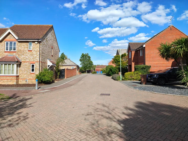 A quiet street with houses on both sides