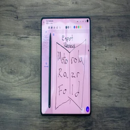 Motorola Razr Fold displaying handwritten message, Moto Pen Ultra on the display