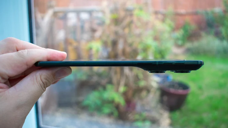 Motorola Razr Fold unfolded in hand, side view