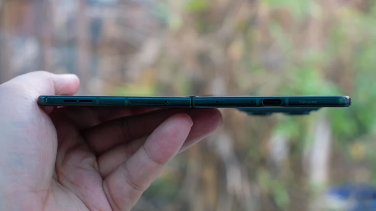 Motorola Razr Fold unfolded in hand, bottom view