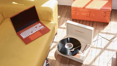 PackardBell DotLoop turntable lifestyle image with DotBook Laptop