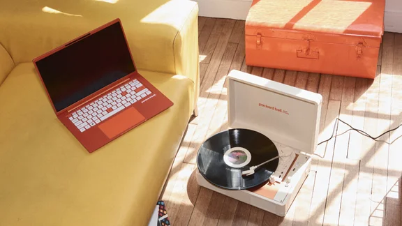 PackardBell DotLoop turntable lifestyle image with DotBook Laptop