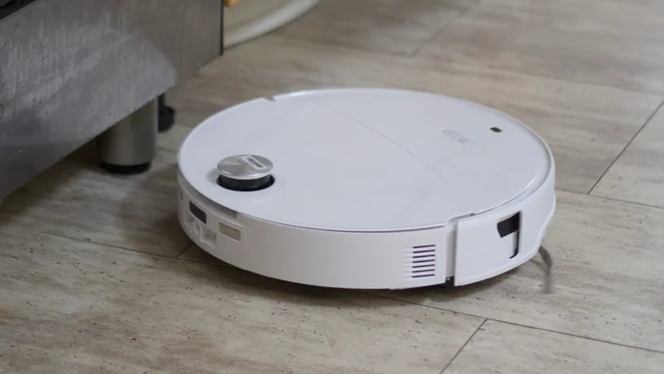 The Roborock Saros 20 Neo in action, cleaning a tiled floor