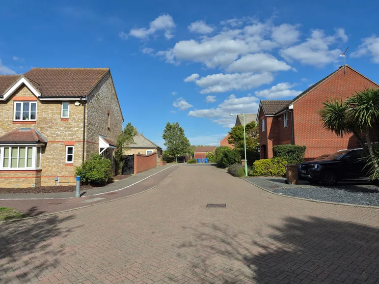 A quiet street with houses on both sides