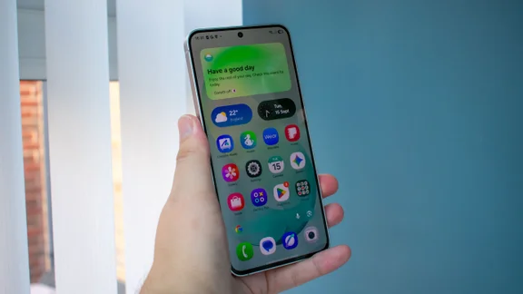 Samsung Galaxy S26 FE in hand, front view