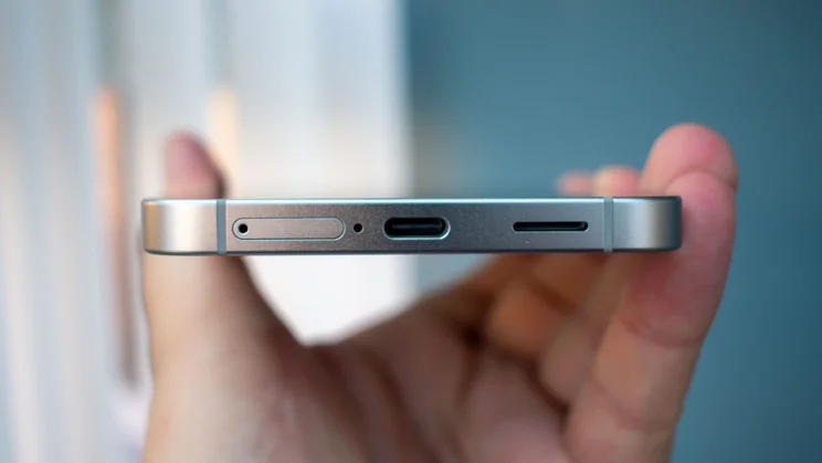Samsung Galaxy S26 FE in hand, bottom view