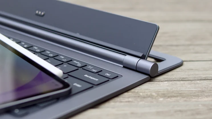 Samsung Galaxy Tab S12 Ultra keyboard cover hinge end cap beside the Backspace, Del and DeX keys, with the tablet corner and stylus at left.