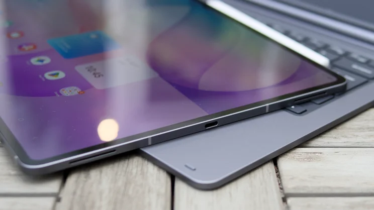 USB-C port and speaker grilles on the bottom edge of the Samsung Galaxy Tab S12 Ultra as it rests over the keyboard base