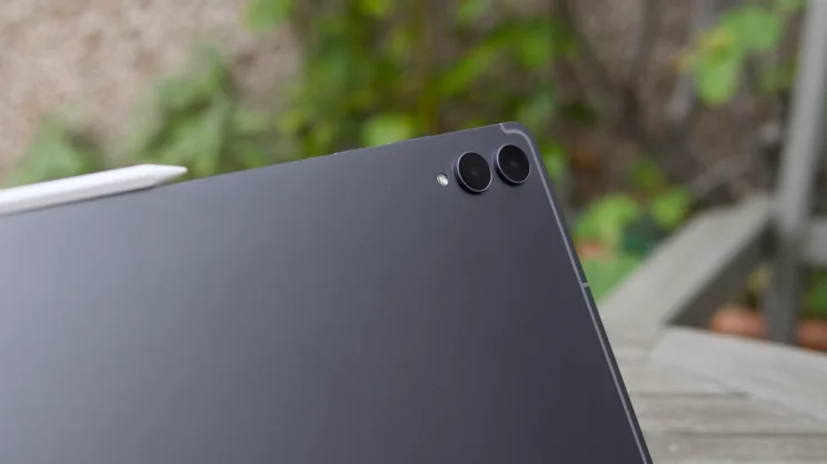 Dual rear cameras and flash on the matte dark grey back of the Samsung Galaxy Tab S12 Ultra, with a white stylus at left