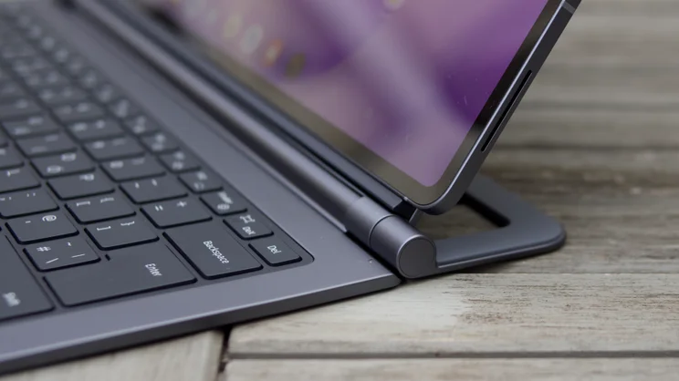 Lower corner of the Samsung Galaxy Tab S12 Ultra rising above the keyboard cover's right-hand hinge and the Enter, Backspace and Del keys