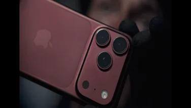 The burgundy iPhone 18 Pro against a dark moody background