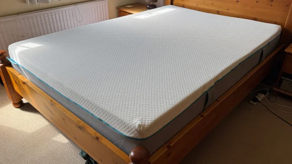 The Simba Simbatex Cool mattress on a wooden bed frame in a bedroom