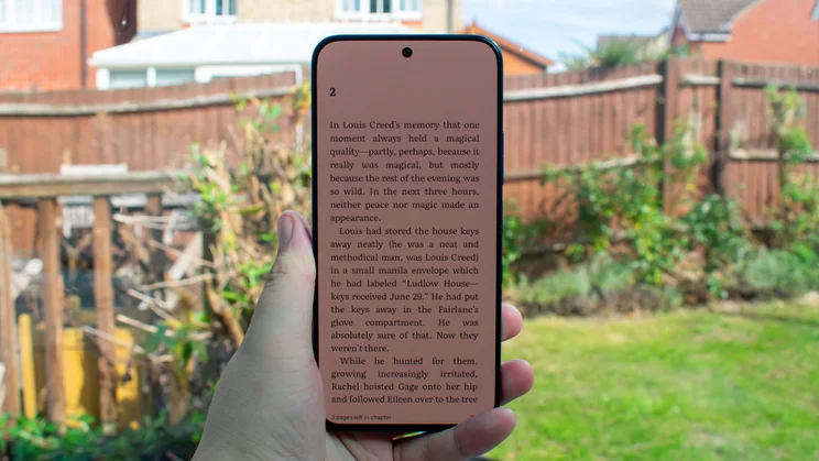 TCL P80 Ultra in hand, ebook on the display