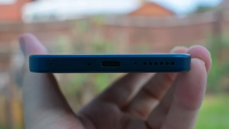 TCL P80 Ultra in hand, bottom view