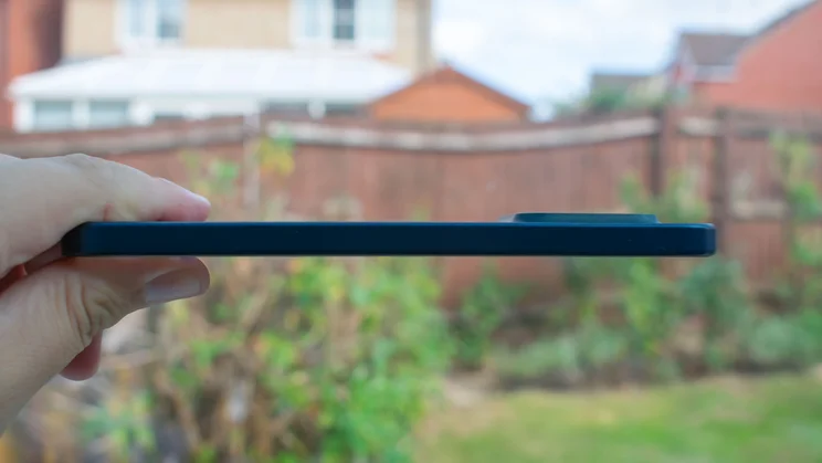 TCL P80 Ultra in hand, left edge