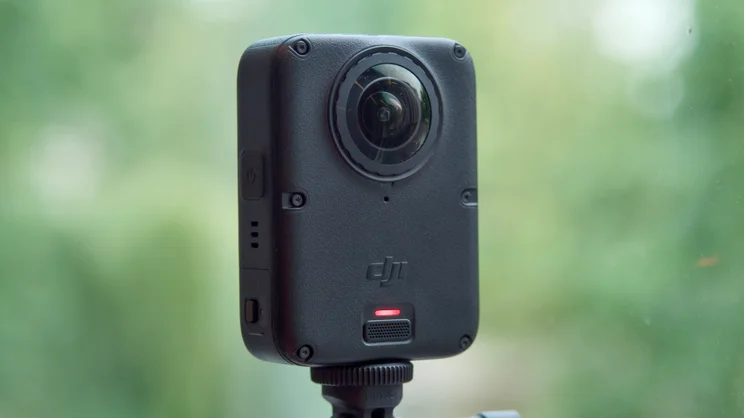 The DJI Osmo 360 II pictured on a selfie stick from the front