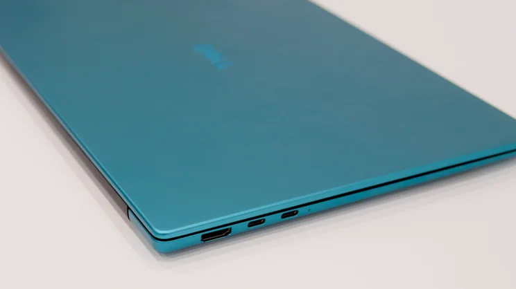The Dell 14S in velvet green, closed pictured from the left edge