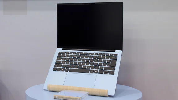 The Dell 14S pictured on a laptop stand, open