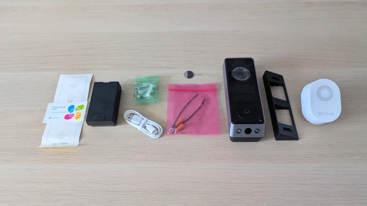 The Ezviz EP8 Ultra's package contents spread out on a desk