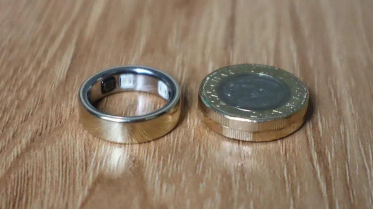 The Oura ring 5 pictured next to two &pound;1 coins