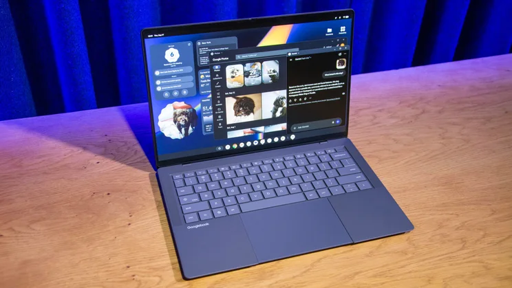 The Asus Googlebook 14 clamshell laptop with its lid open on a wooden desk