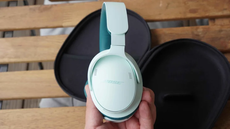 The Bose QuietComfort Headphones 2nd Gen being held in one hand
